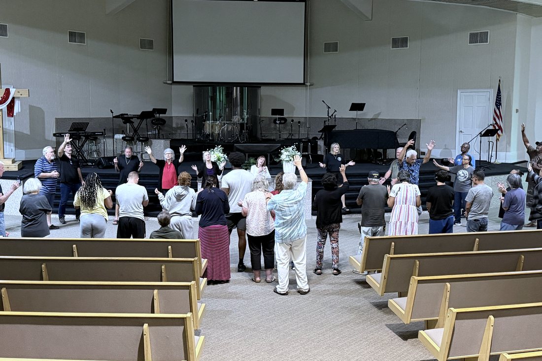 The church body gathered to pray